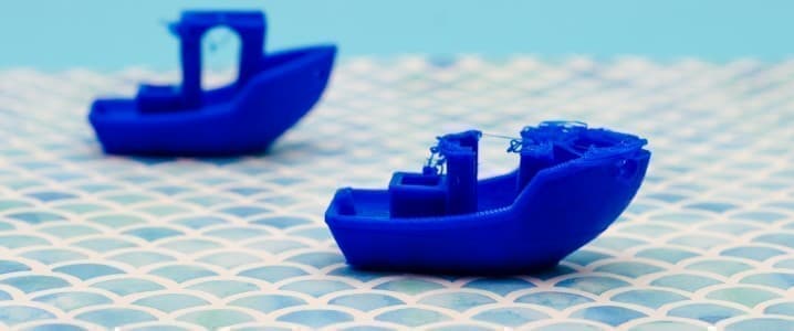Blue toy ships floating on a grid