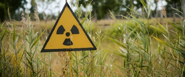 nuclear fallout warning sign in a field